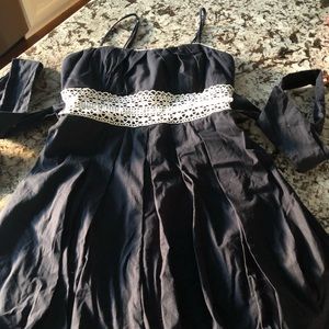 Spaghetti strap dress with tied waistline.